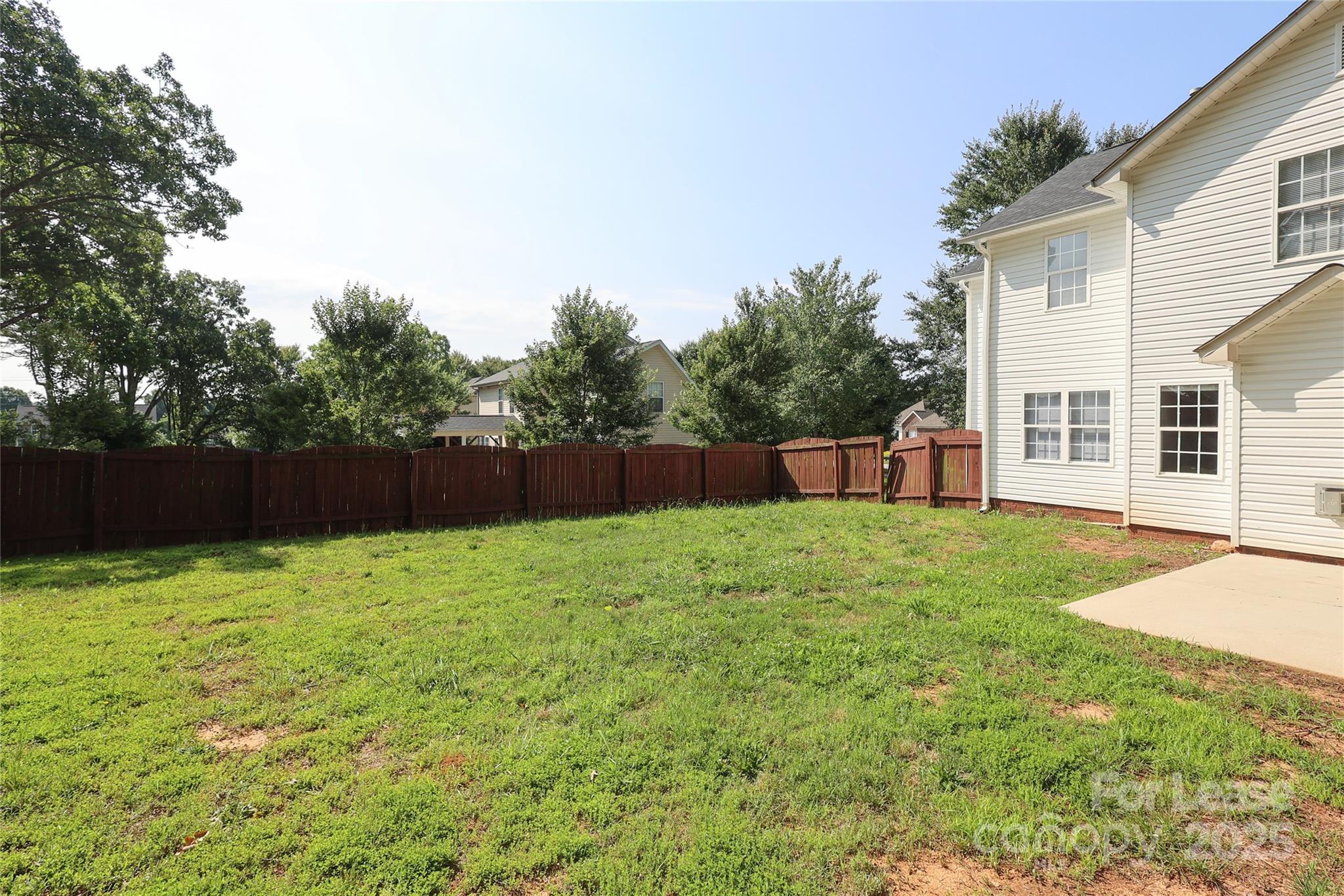 4112 Chatterleigh Drive Monroe, NC 28110 - Photo 40 of 43 a backyard of a house with lots of green space