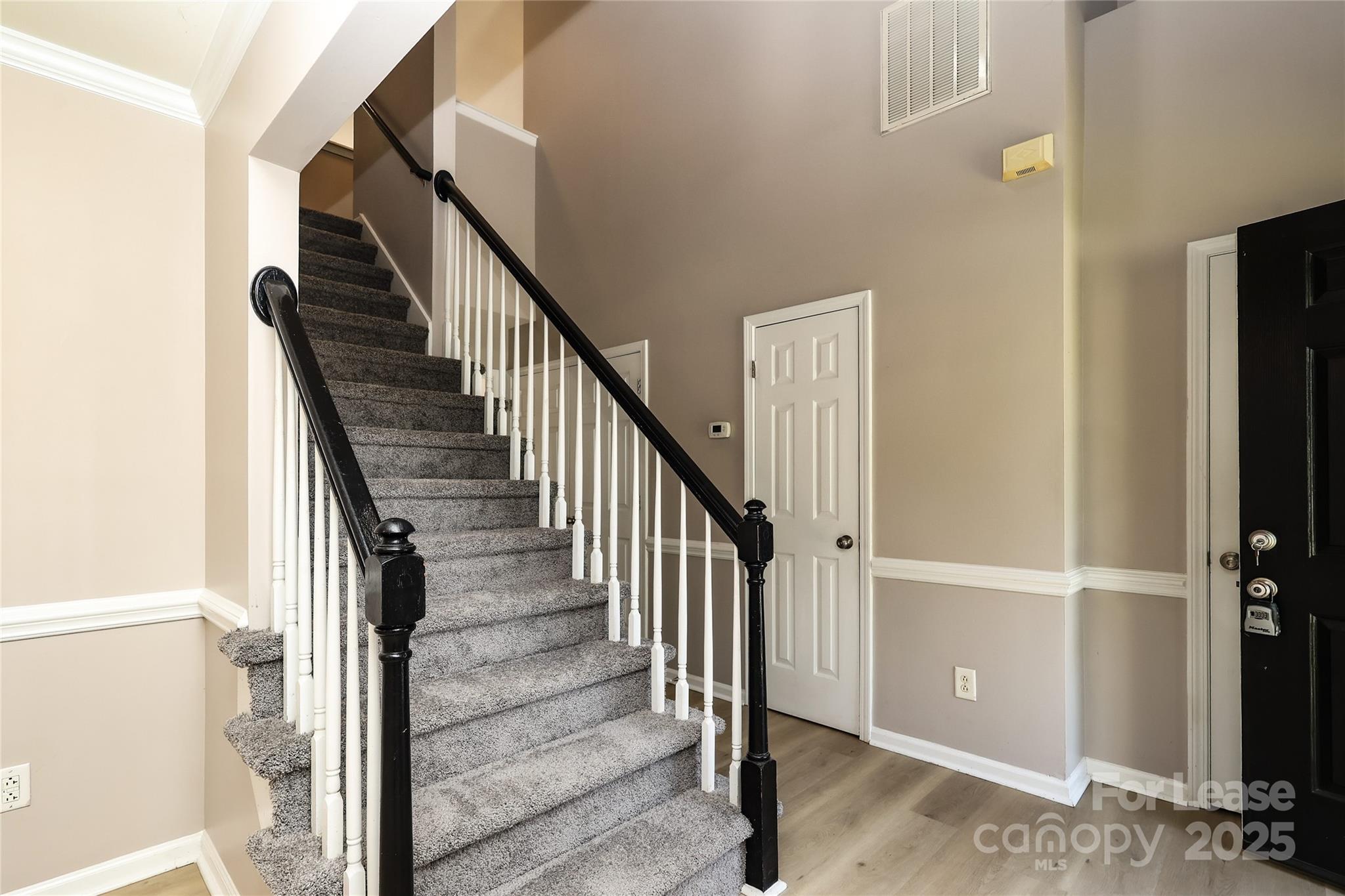 4112 Chatterleigh Drive Monroe, NC 28110 - Photo 4 of 43 a view of a hallway with wooden floor and entryway