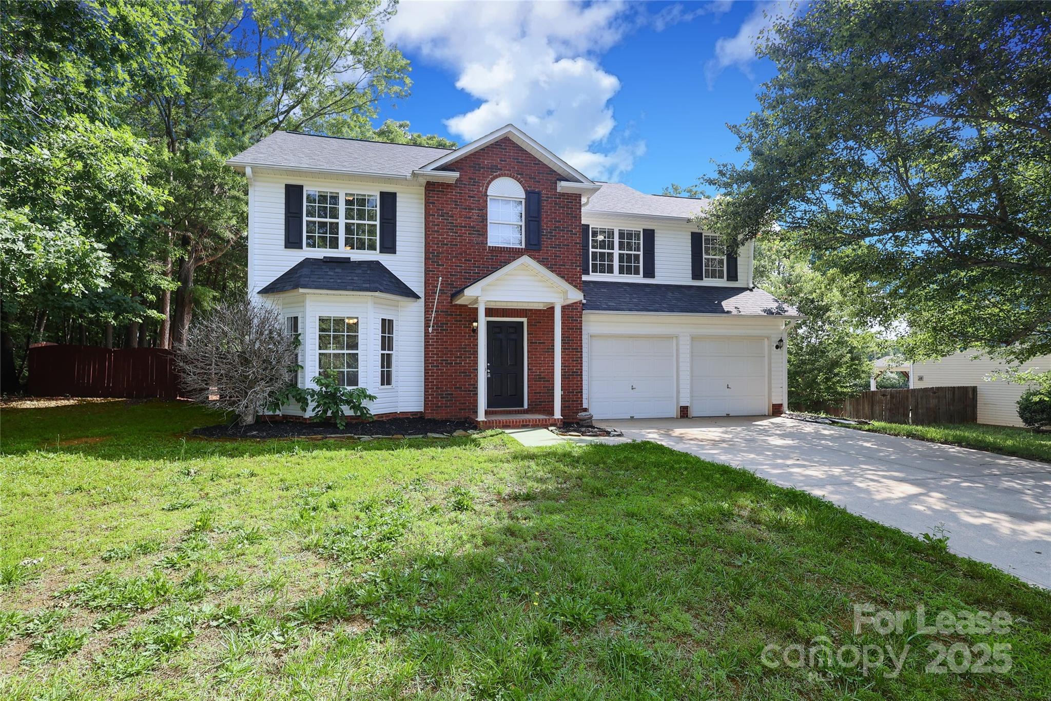 4112 Chatterleigh Drive Monroe, NC 28110 - Photo 43 of 43 a front view of a house with a garden and yard