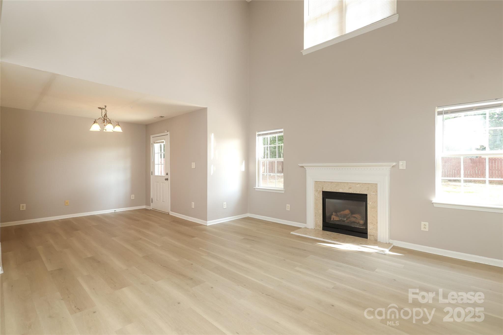 4112 Chatterleigh Drive Monroe, NC 28110 - Photo 10 of 43 a view of an empty room with window and fire place