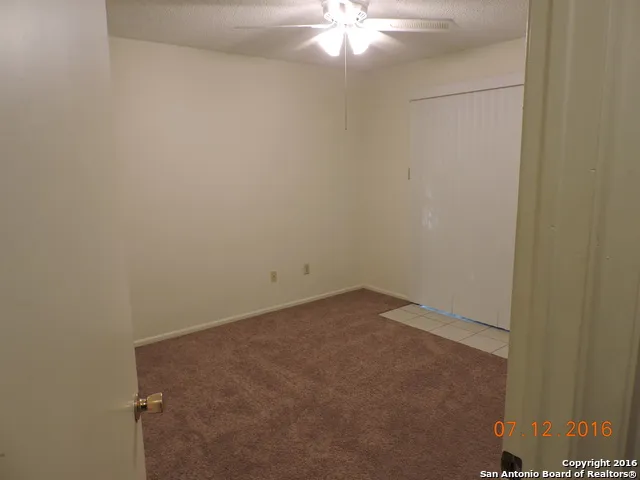 a view of a room with a fan