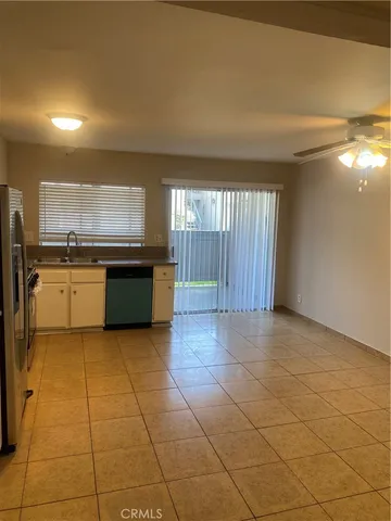 a view of a kitchen with a sink and a stove top oven