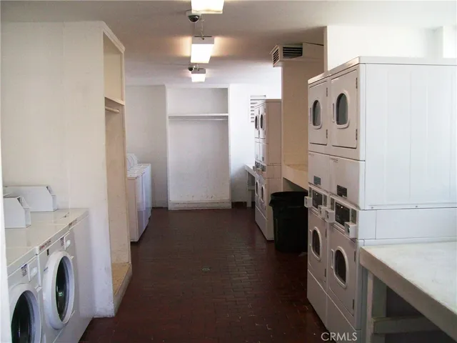 a view of kitchen and utility room with washer and dryer