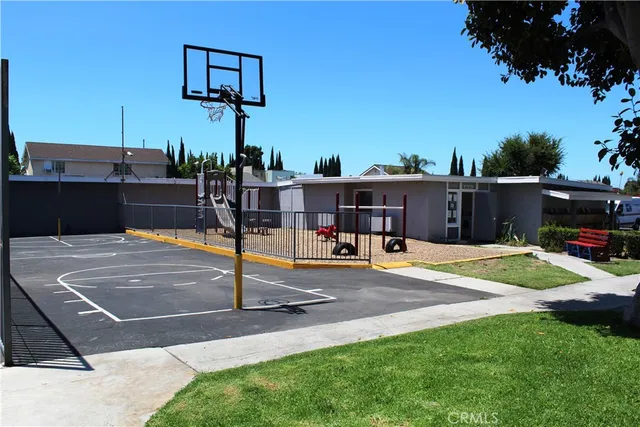 a view of a patio with a table and chairs