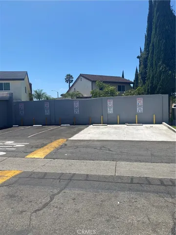 a swimming pool view with a seating space