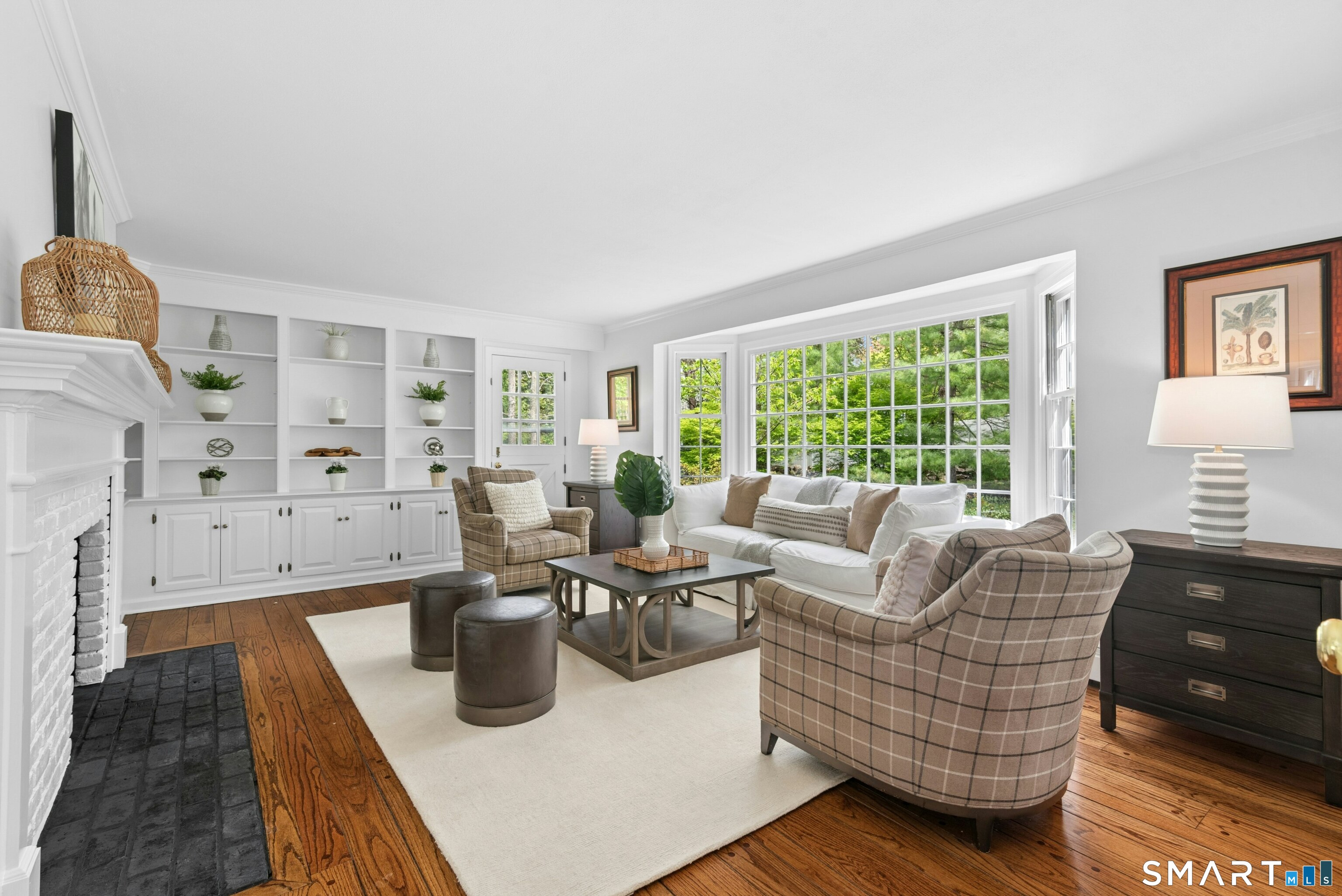 254 White Oak Shade Road New Canaan, CT 06840 - Photo 12 of 31 a living room with furniture and a fireplace