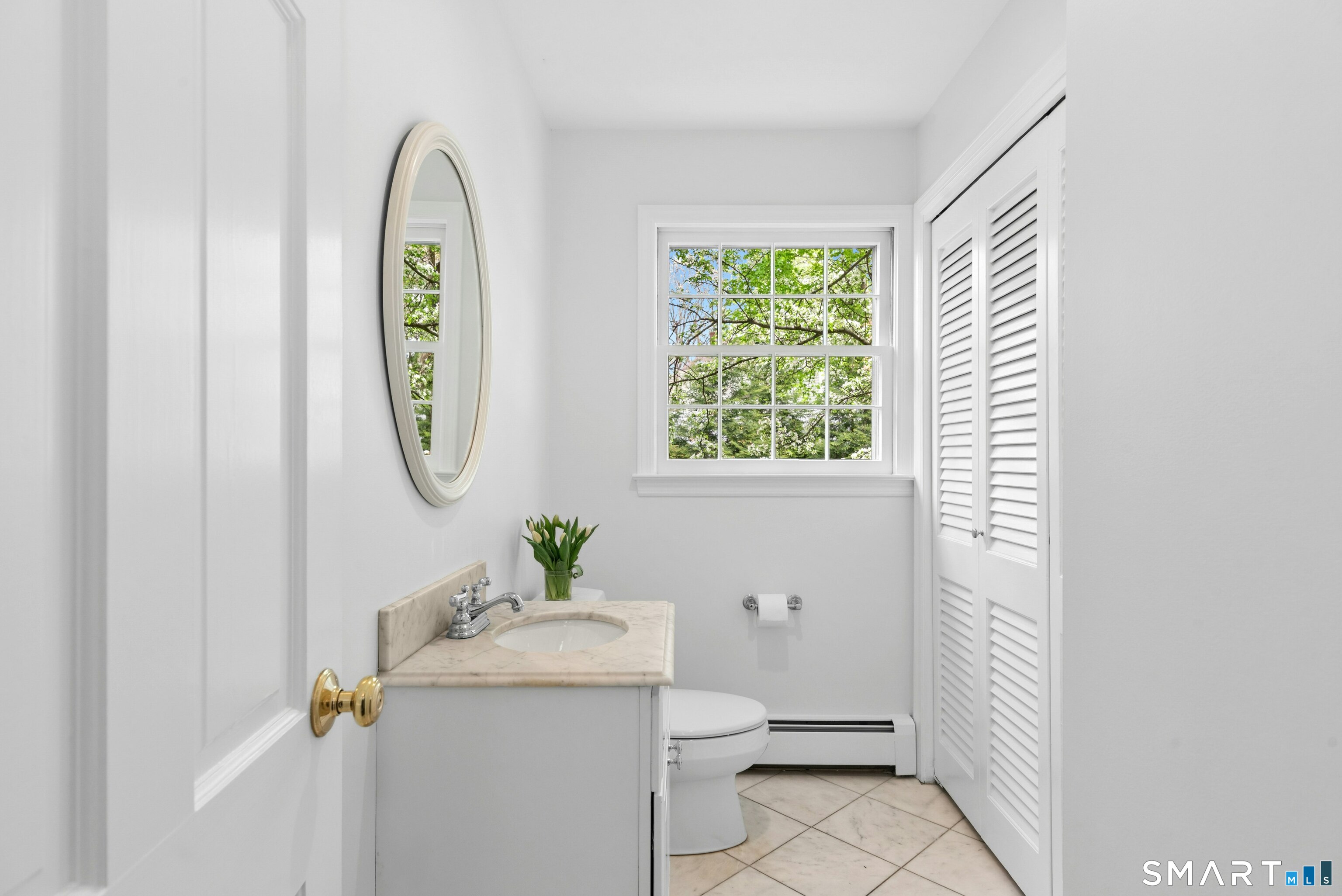254 White Oak Shade Road New Canaan, CT 06840 - Photo 19 of 31 a bathroom with a sink mirror vanity and toilet