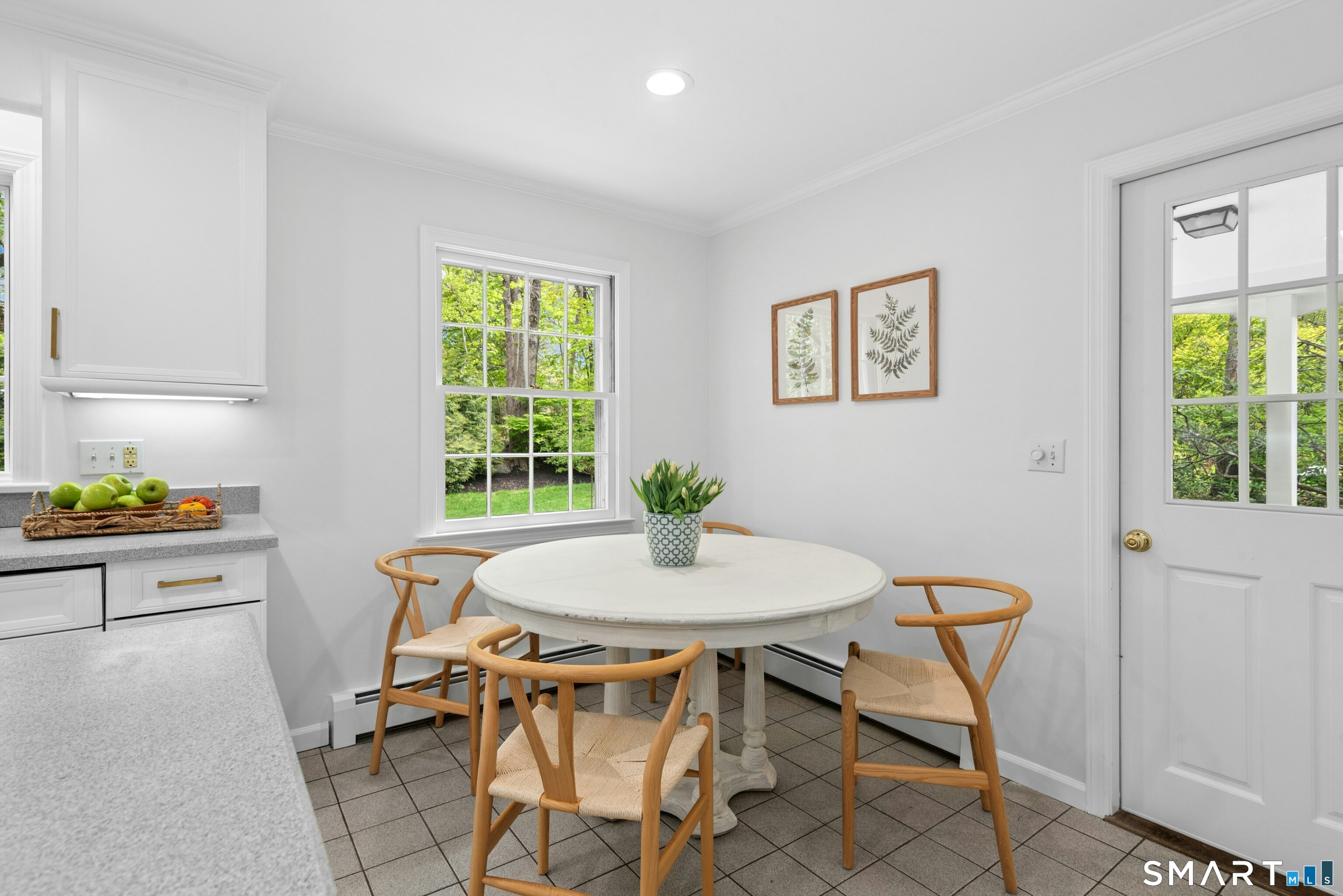 254 White Oak Shade Road New Canaan, CT 06840 - Photo 20 of 31 a view of a dining room with furniture and a window