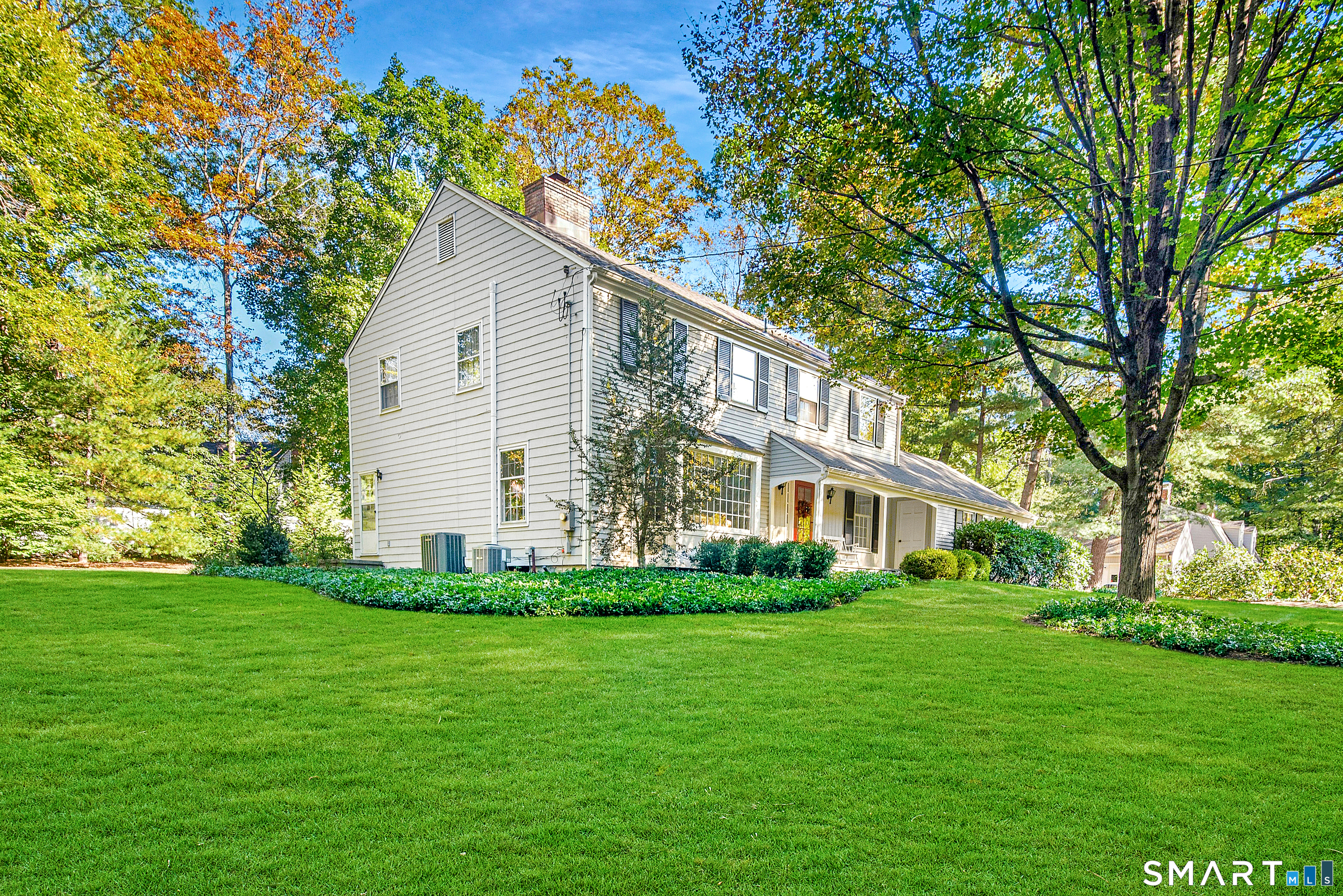 254 White Oak Shade Road New Canaan, CT 06840 - Photo 2 of 31 a house view with a garden space