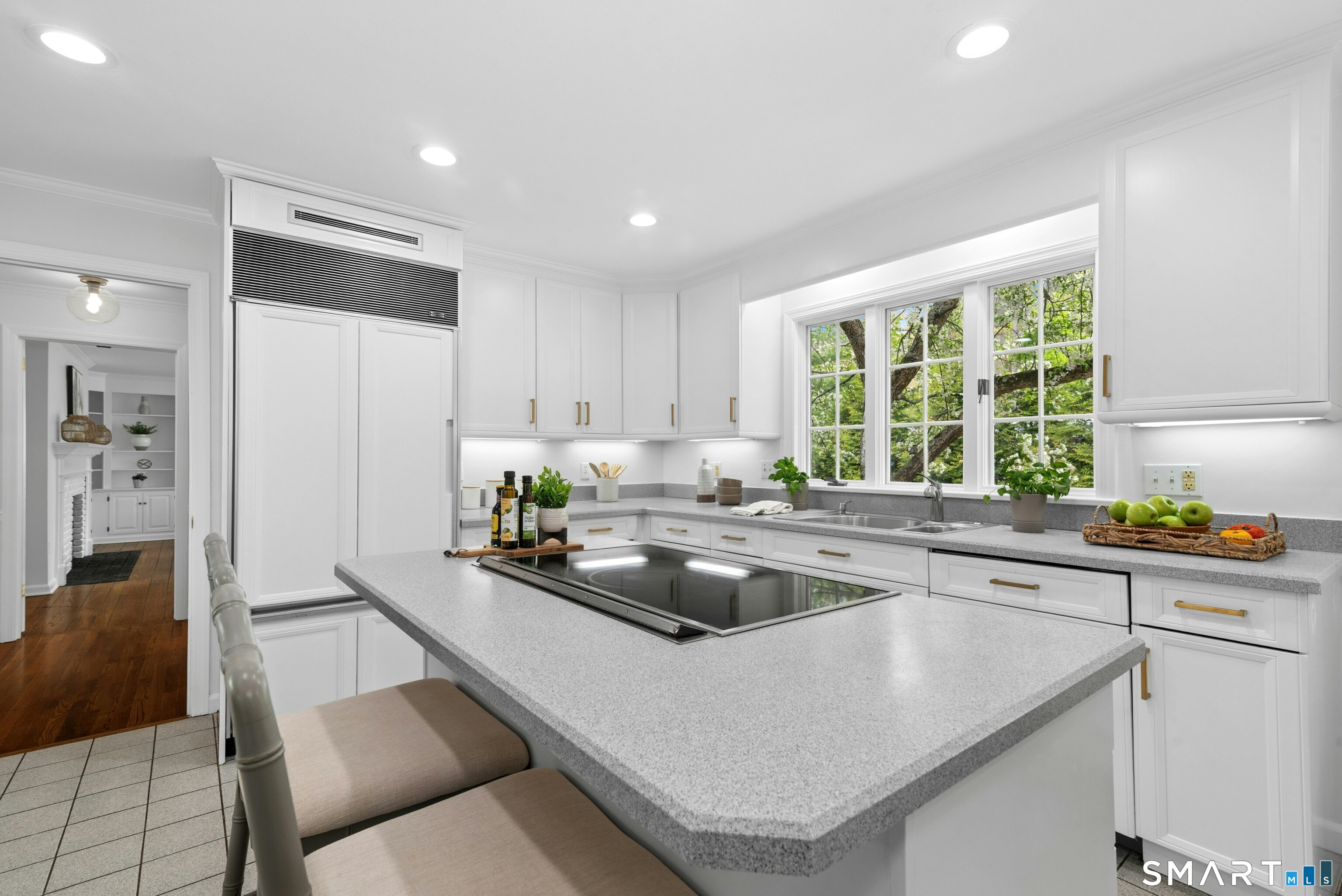 254 White Oak Shade Road New Canaan, CT 06840 - Photo 22 of 31 a kitchen that has a sink and chairs in it