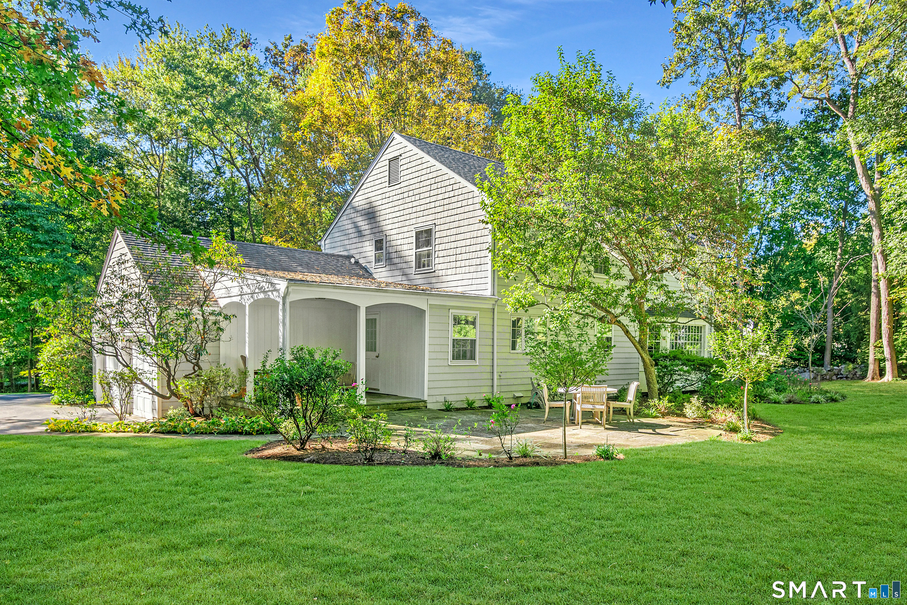 254 White Oak Shade Road New Canaan, CT 06840 - Photo 5 of 31 a view of a house with a yard