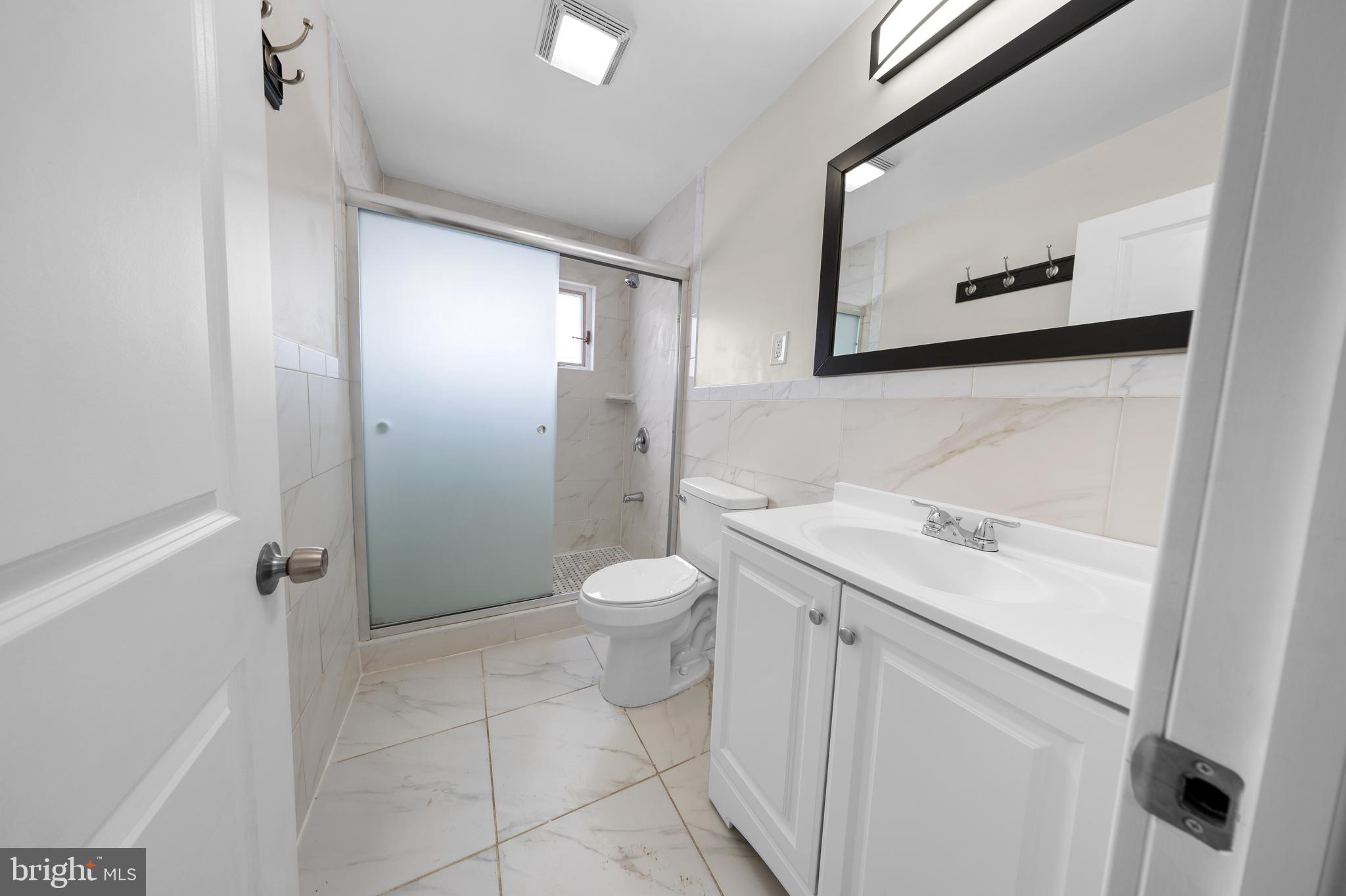 727 Sherrie Road Philadelphia, PA 19115 - Photo 15 of 18 a bathroom with a granite countertop sink toilet and shower