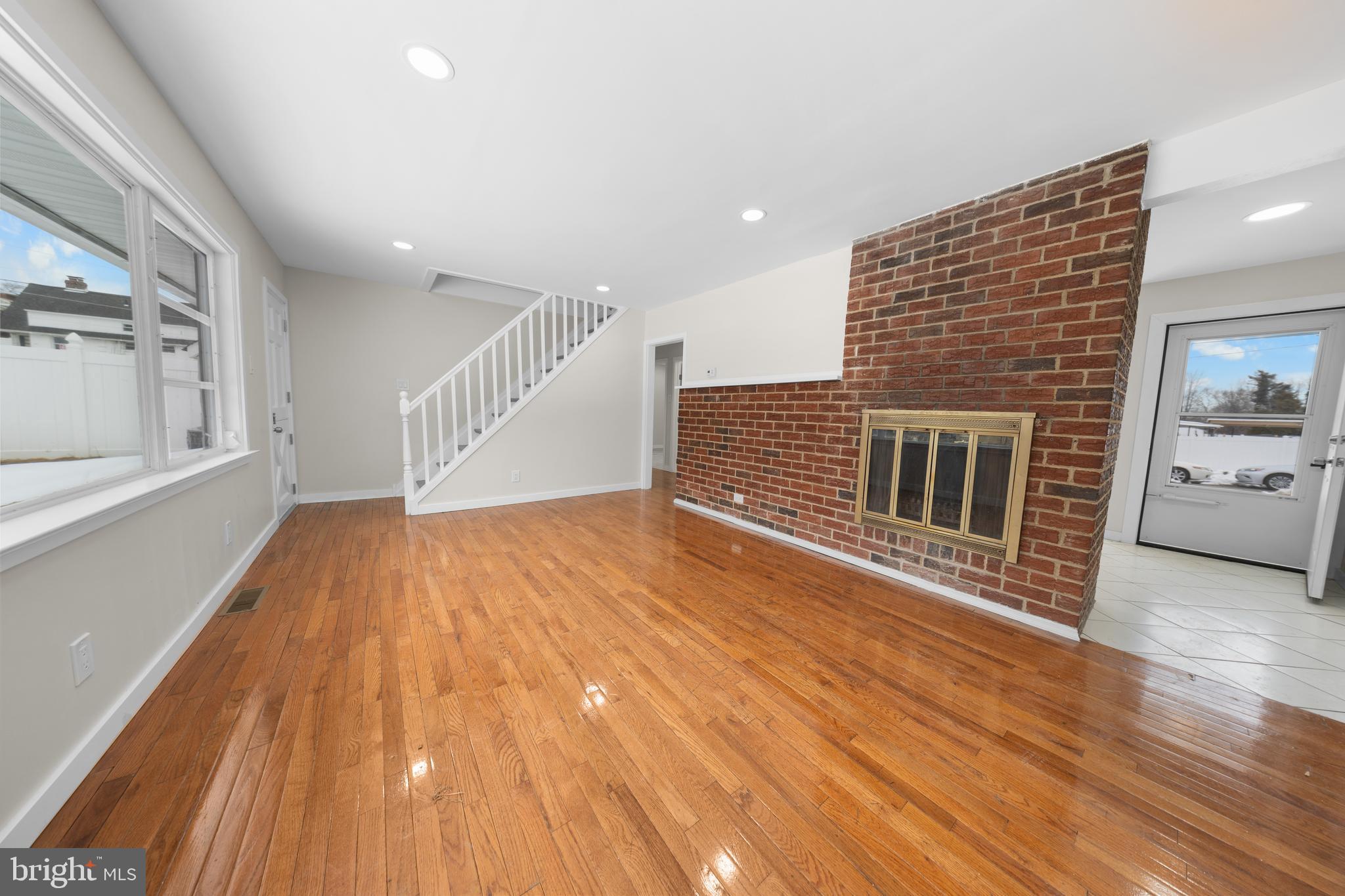 727 Sherrie Road Philadelphia, PA 19115 - Photo 3 of 18 a view of an empty room with wooden floor and a window