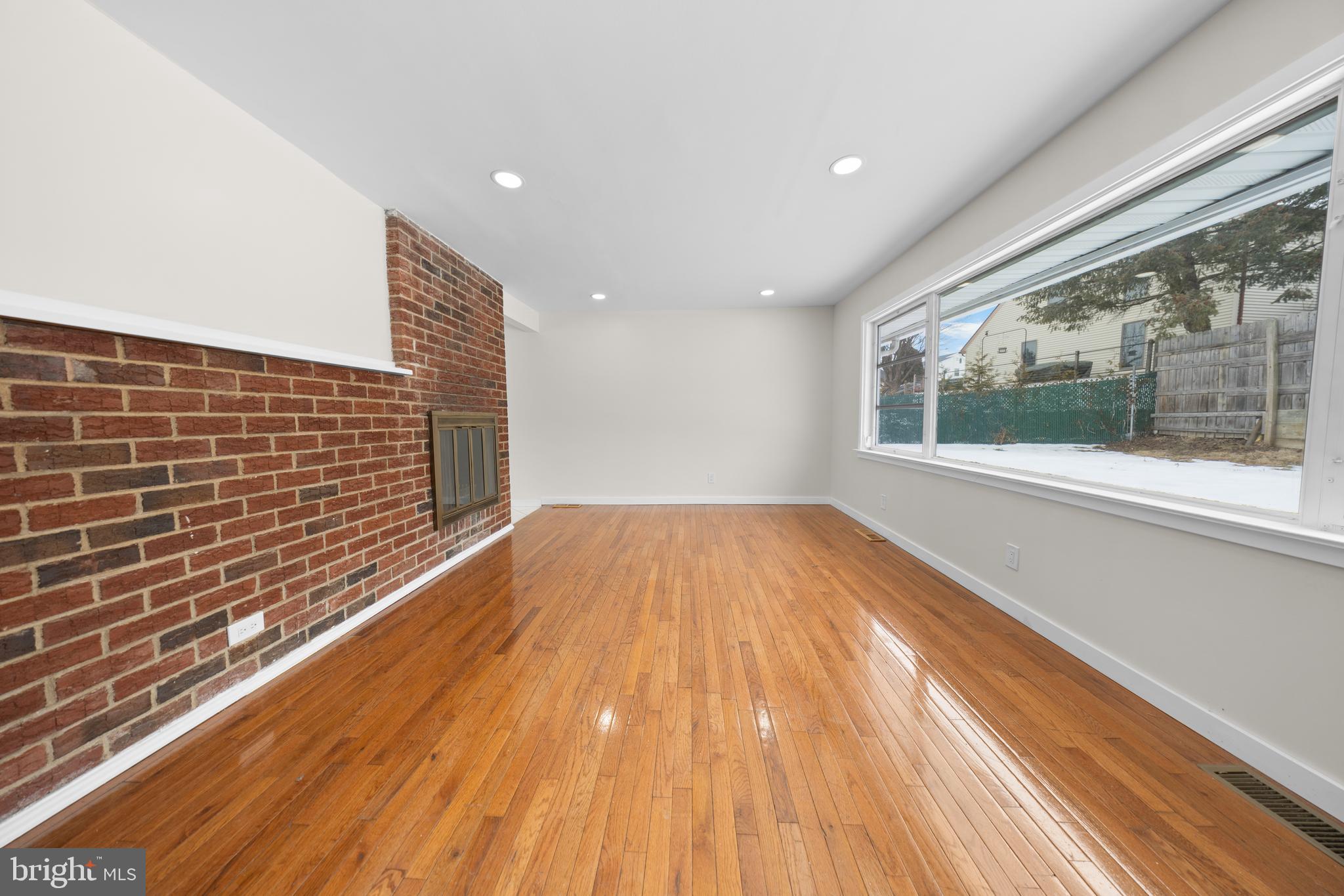 727 Sherrie Road Philadelphia, PA 19115 - Photo 10 of 18 a view of empty room with wooden floor and fan
