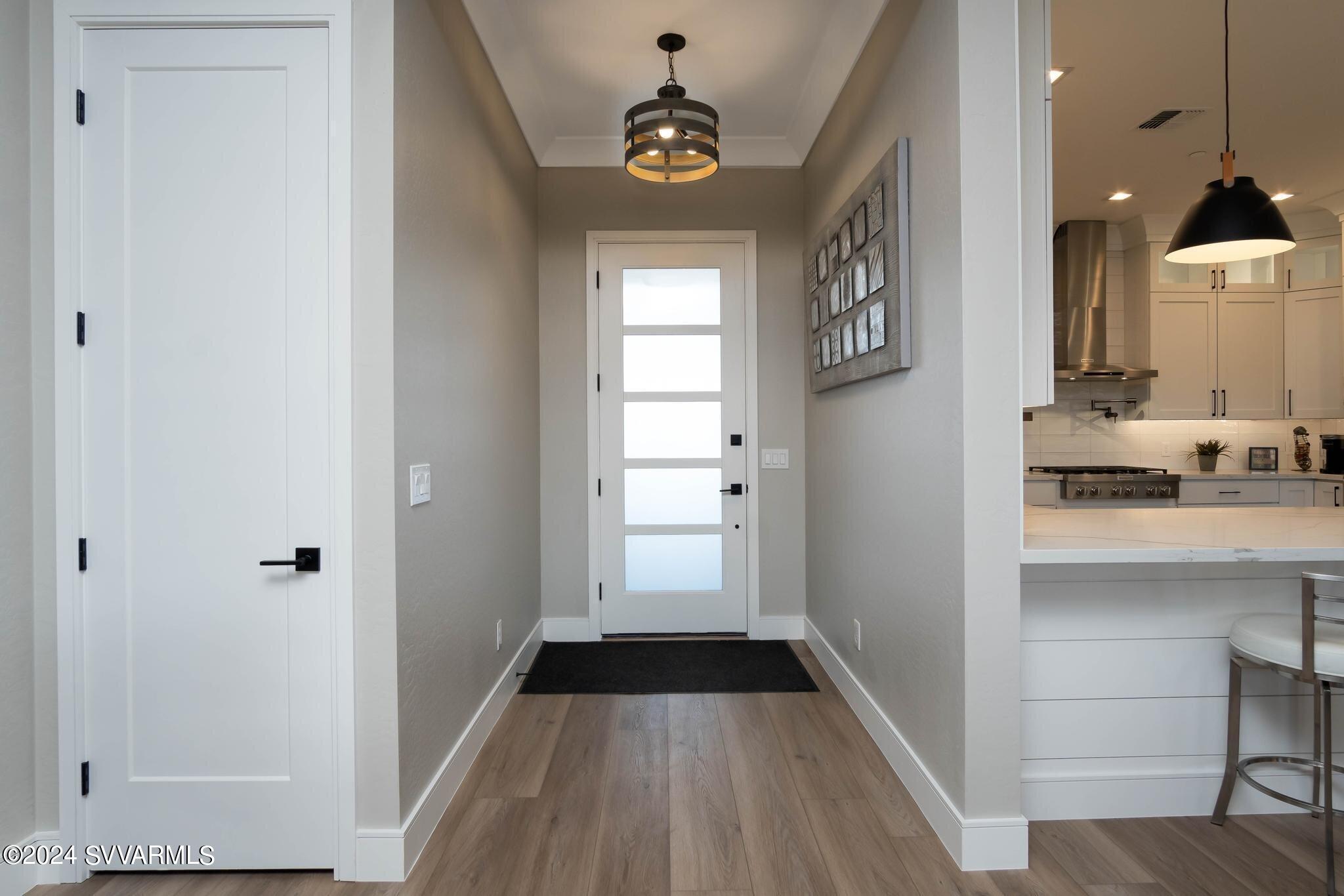 699 Moore Gulch Road, Unit LOT 117 Clarkdale, AZ 86324 - Photo 13 of 81 a view of a hallway view with wooden floor and staircase