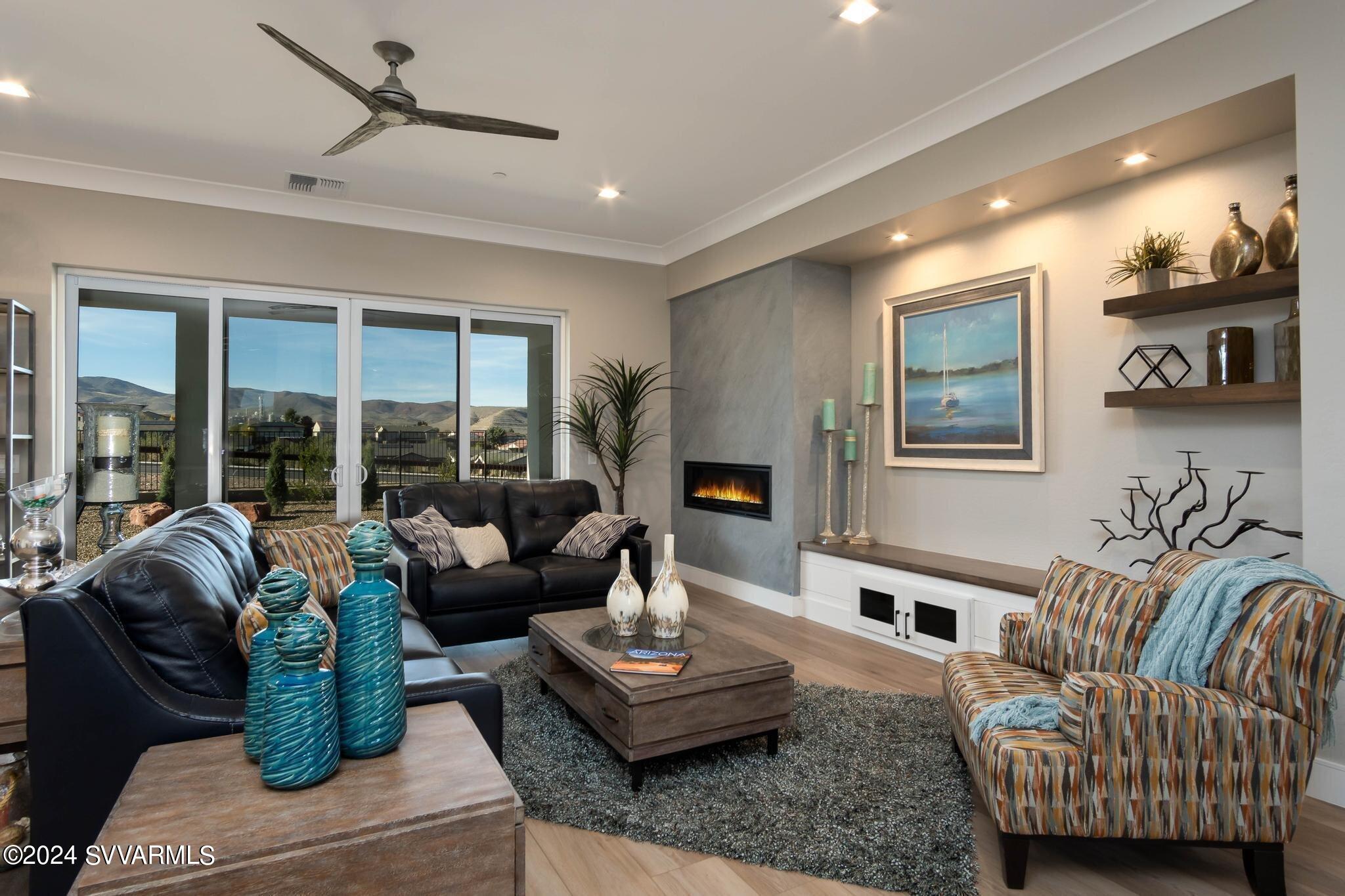 699 Moore Gulch Road, Unit LOT 117 Clarkdale, AZ 86324 - Photo 15 of 81 a living room with furniture and a large window