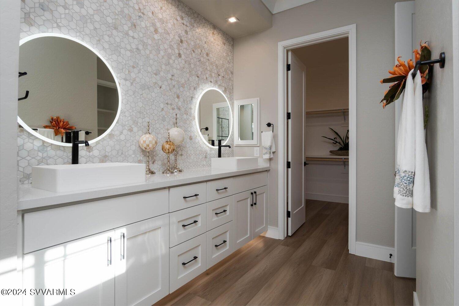 699 Moore Gulch Road, Unit LOT 117 Clarkdale, AZ 86324 - Photo 33 of 81 a bathroom with a double vanity sink mirror and shower