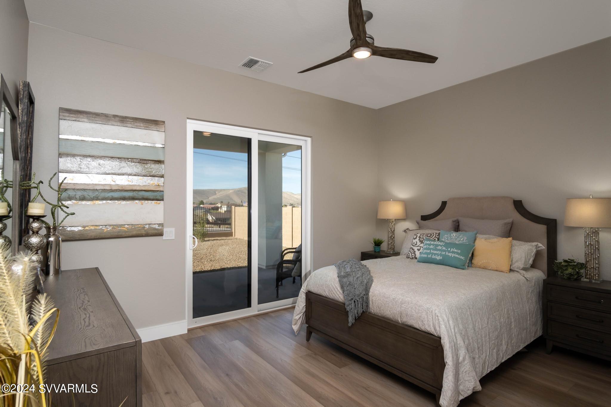 699 Moore Gulch Road, Unit LOT 117 Clarkdale, AZ 86324 - Photo 41 of 81 a bedroom with a bed and a walk in closet