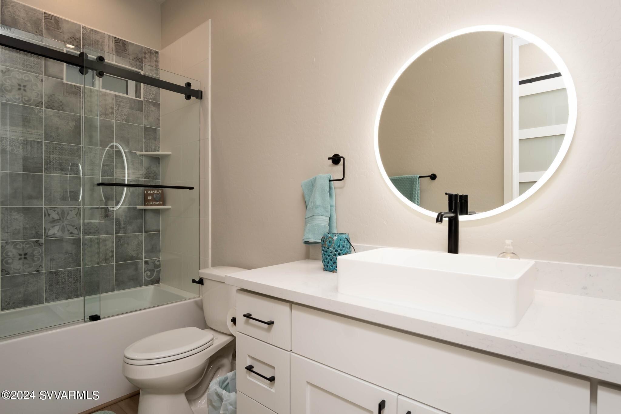 699 Moore Gulch Road, Unit LOT 117 Clarkdale, AZ 86324 - Photo 43 of 81 a bathroom with a sink a toilet and shower