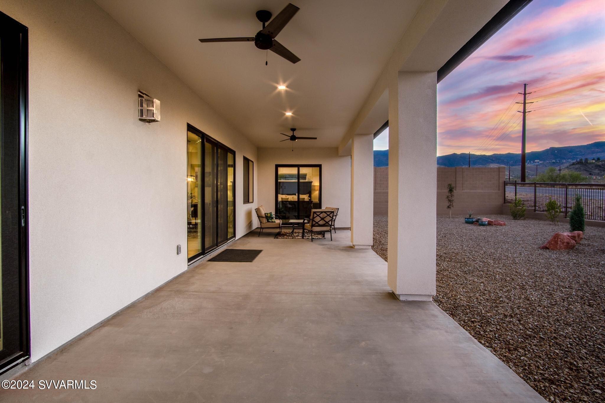 699 Moore Gulch Road, Unit LOT 117 Clarkdale, AZ 86324 - Photo 48 of 81 a view of a livingroom with furniture and a ceiling fan