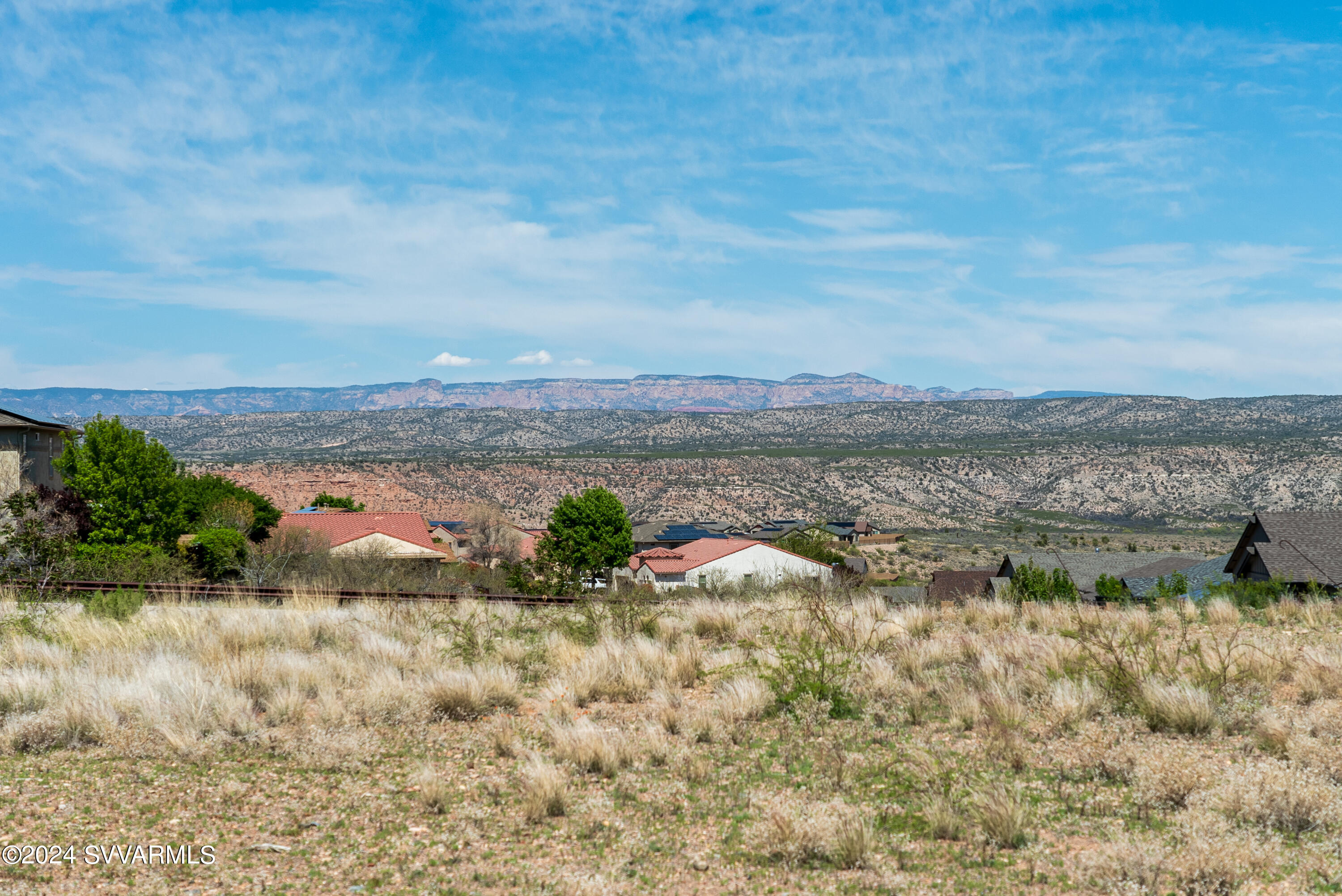 699 Moore Gulch Road, Unit LOT 117 Clarkdale, AZ 86324 - Photo 62 of 81 a view of a lake with mountains in the background