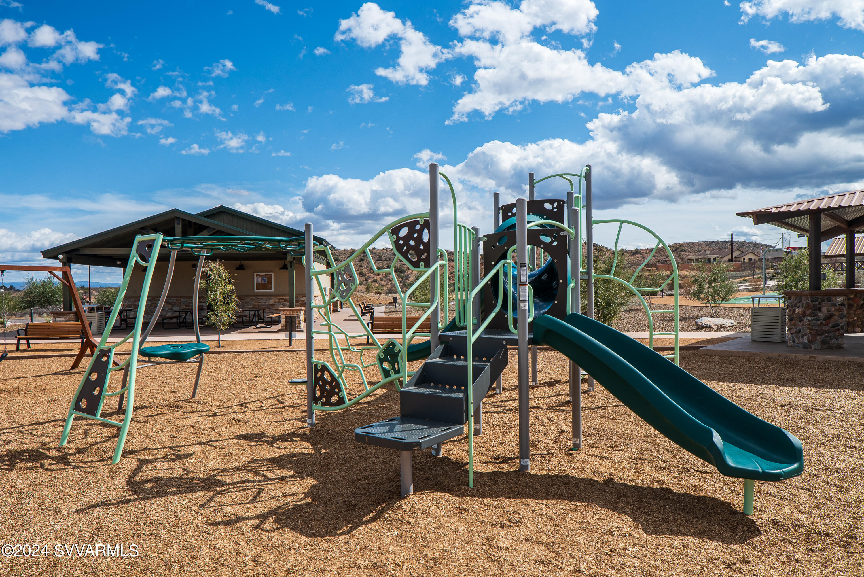 699 Moore Gulch Road, Unit LOT 117 Clarkdale, AZ 86324 - Photo 77 of 81 a view of a house with backyard water fountain and sitting area