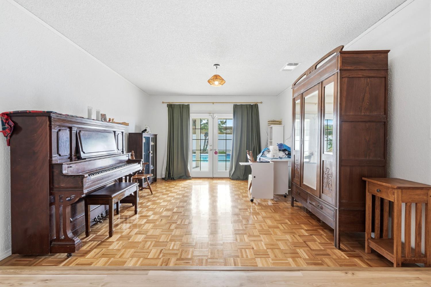 905 Redwood Lane Lemoore, CA 93245 - Photo 16 of 56 a living room with furniture and a window