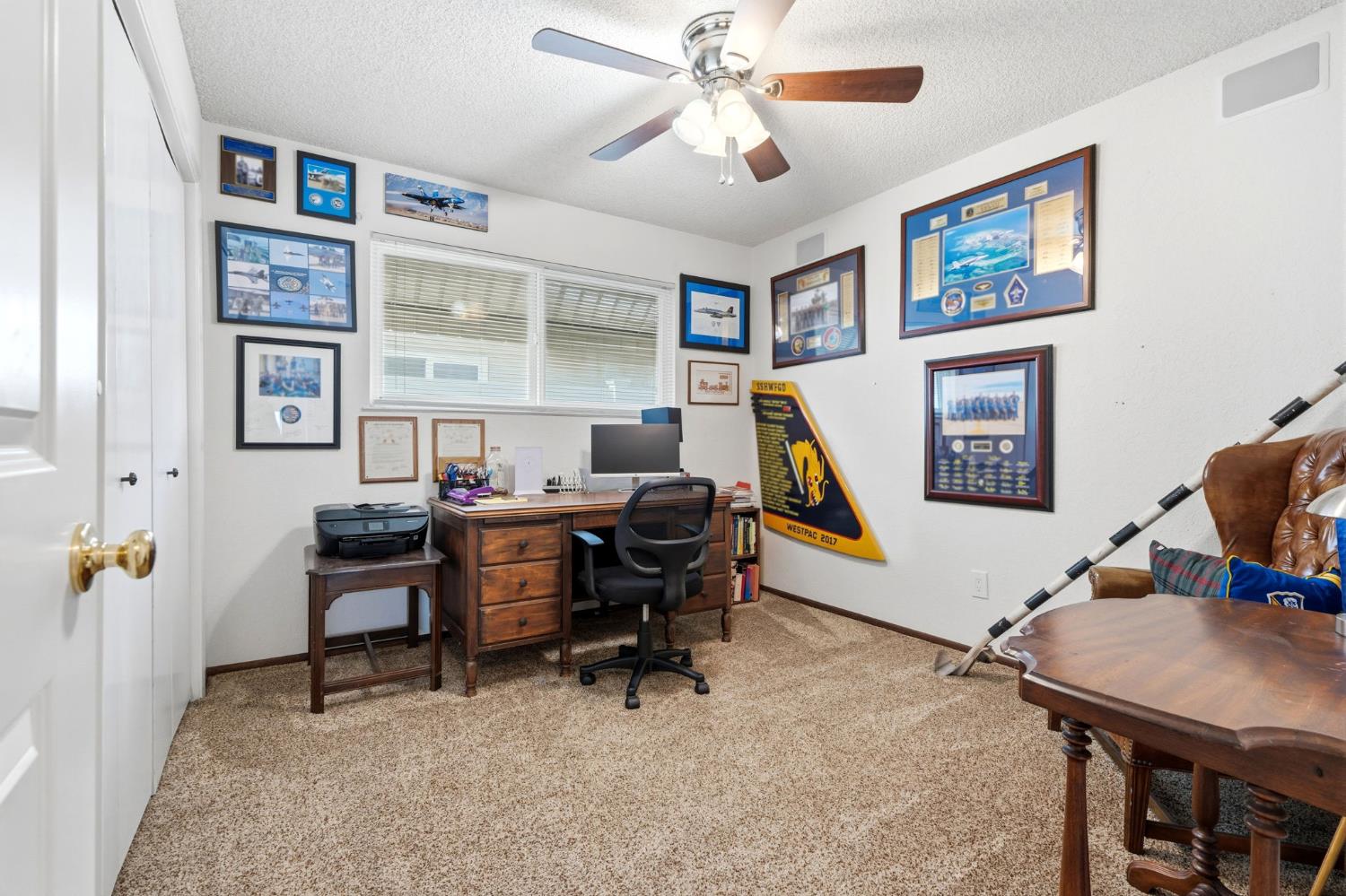 905 Redwood Lane Lemoore, CA 93245 - Photo 38 of 56 a view of a workspace with furniture and a workspace