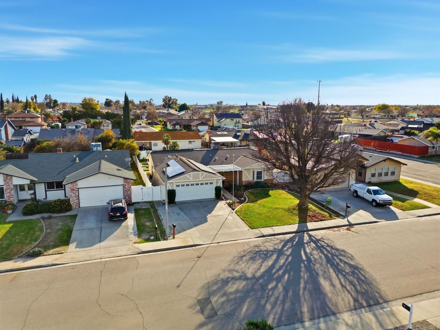 905 Redwood Lane Lemoore, CA 93245 - Photo 6 of 56 an aerial view of residential houses with outdoor space and swimming pool