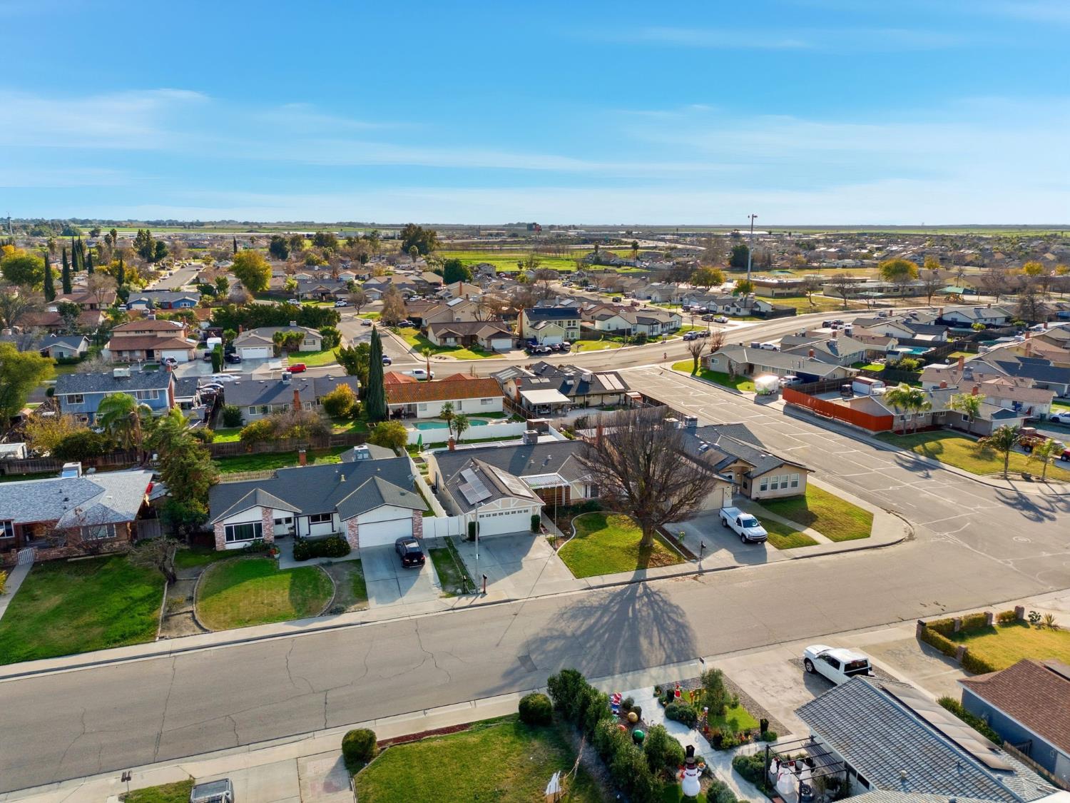 905 Redwood Lane Lemoore, CA 93245 - Photo 9 of 56 an aerial view of residential houses with outdoor space and swimming pool