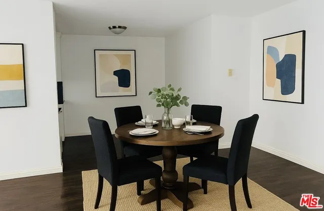 a dining room with furniture and wooden floor