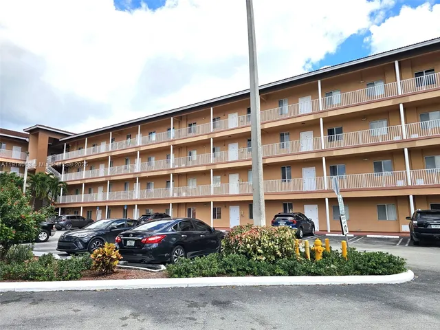 a front view of a building with garden