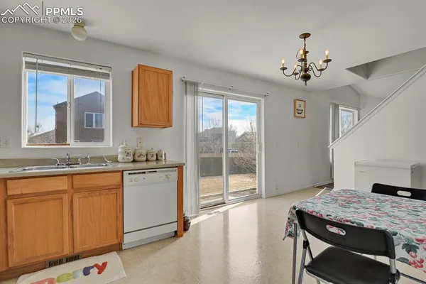 a spacious bathroom with a granite countertop sink a mirror and a bathtub