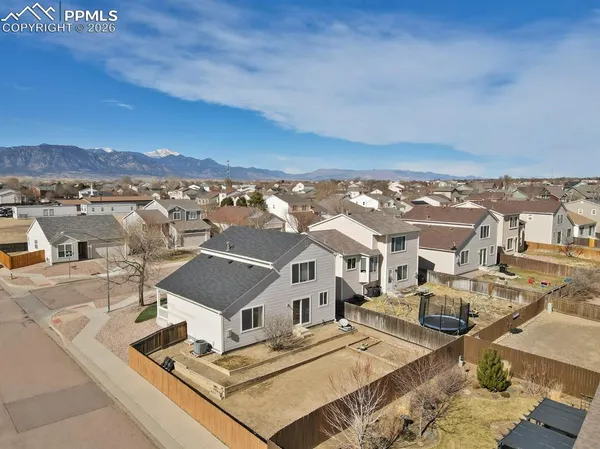 an aerial view of residential houses with outdoor space