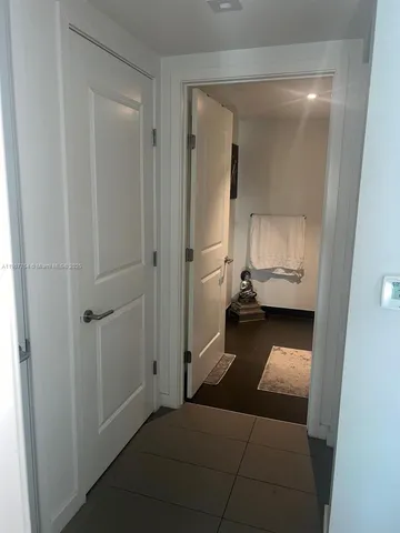 a view of utility room and closet