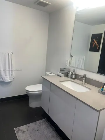 a kitchen with a stove a sink and a refrigerator