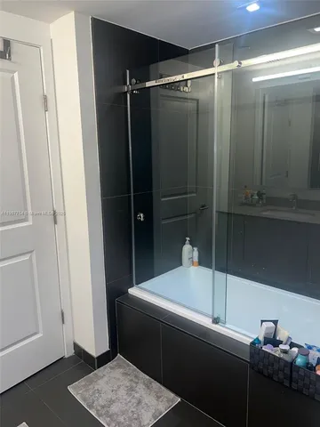 a bathroom with a sink toilet and mirror