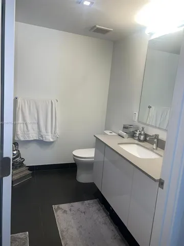 a kitchen with a sink and a stove top oven