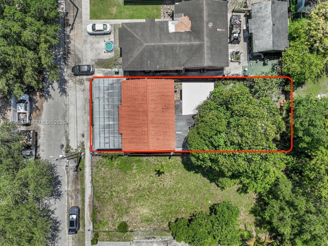 1360 Northwest 77th Street Miami, FL 33147 - Photo 34 of 41 an aerial view of residential house with outdoor space and trees