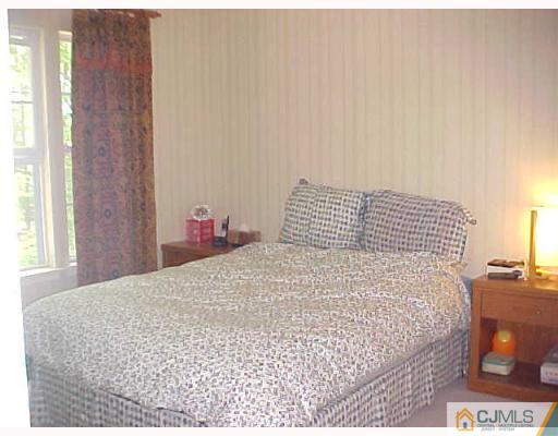 246 Hawthorne Road North Brunswick, NJ 08902 - Photo 4 of 4 a bedroom with a bed and a window