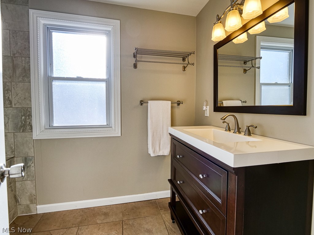 3844 Severn Road Cleveland Heights, OH 44118 - Photo 23 of 35 Main bath up, newer vanity, mirror and light fixture.