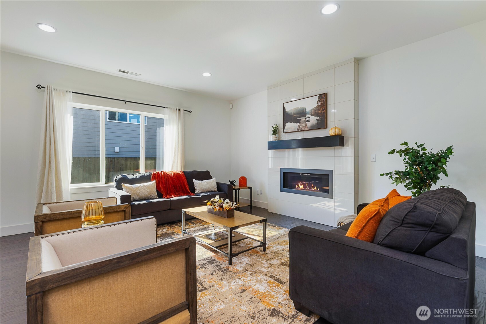 4214 223rd Place Southeast Bothell, WA 98021 - Photo 1 of 37 a living room with furniture and a fireplace