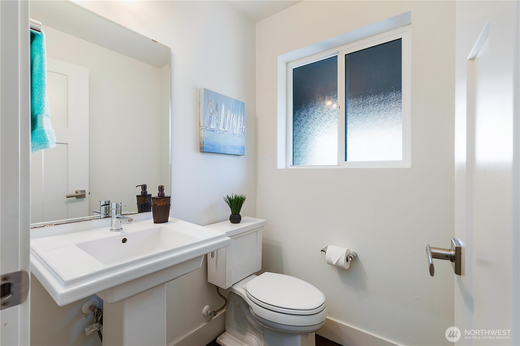 4214 223rd Place Southeast Bothell, WA 98021 - Photo 18 of 37 a bathroom with a sink a toilet and mirror