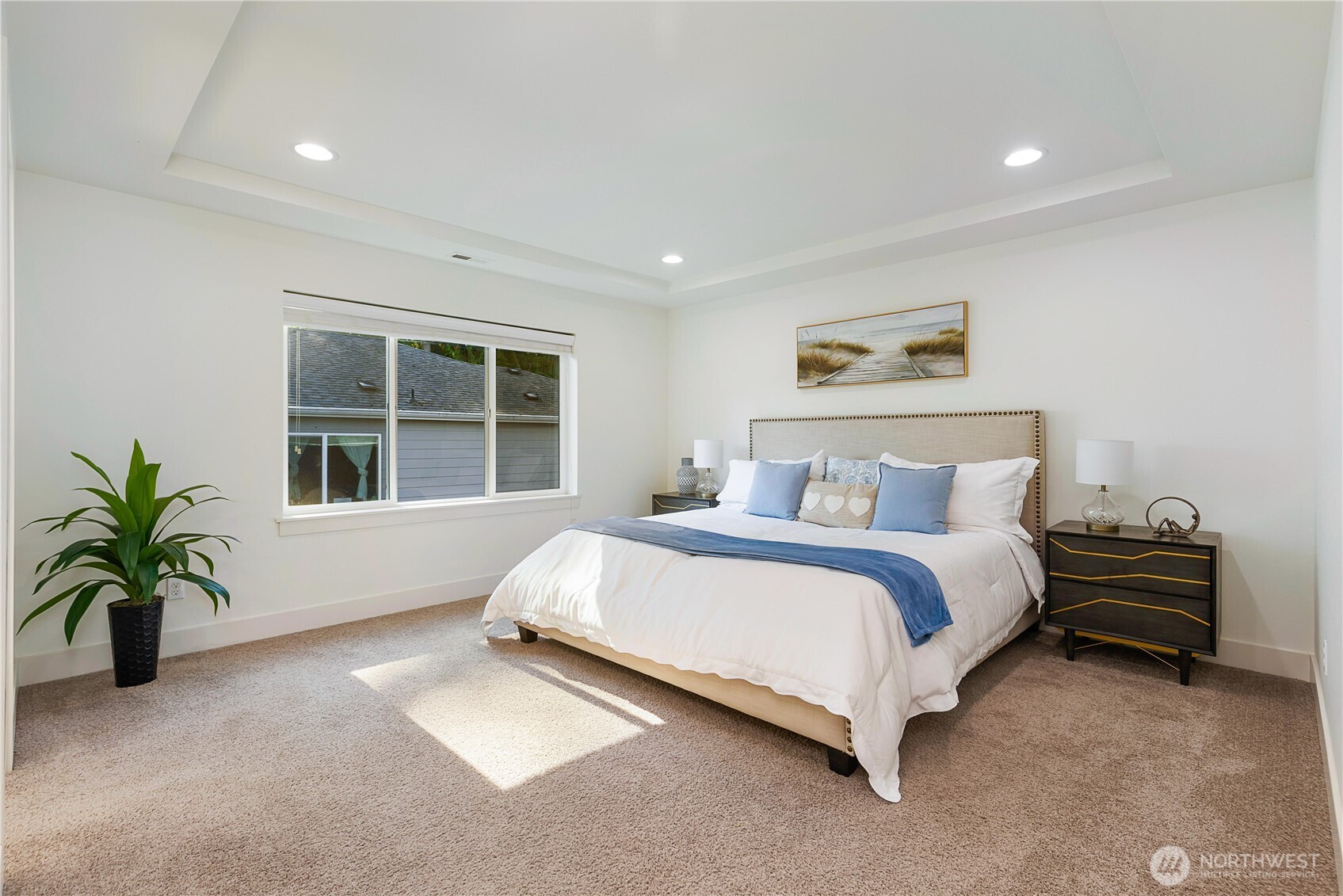 4214 223rd Place Southeast Bothell, WA 98021 - Photo 19 of 37 a spacious bedroom with a bed and glass window