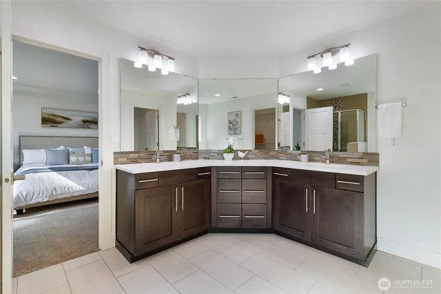 a spacious bathroom with a sink vanity and mirror