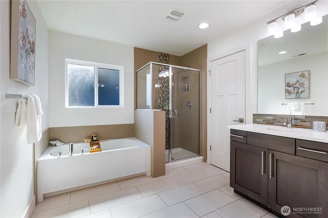 a bathroom with a bathtub and a sink