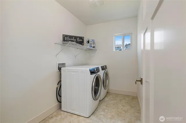a utility room with dryer and washer
