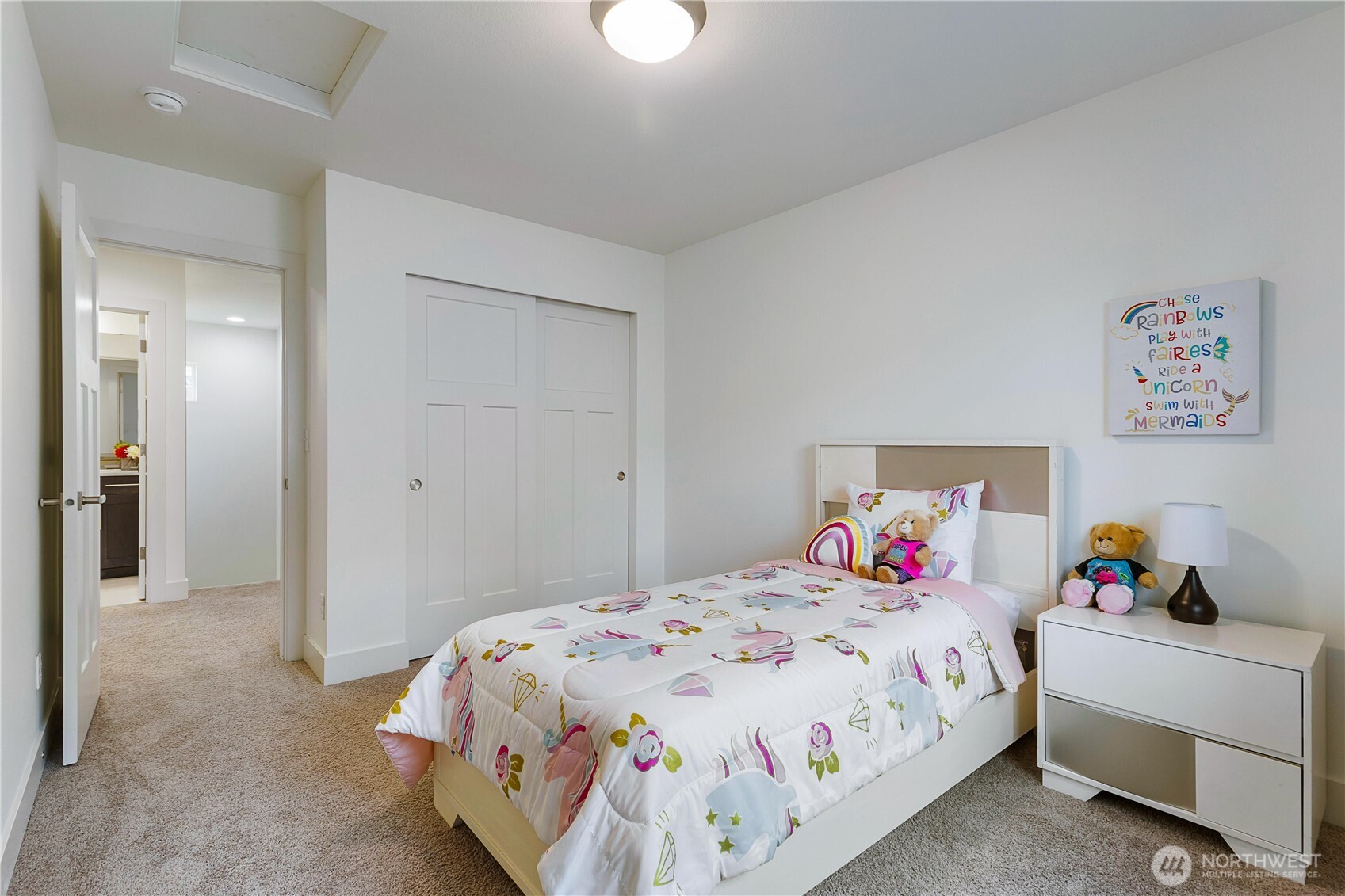 4214 223rd Place Southeast Bothell, WA 98021 - Photo 26 of 37 a bedroom with a bed and a chandelier