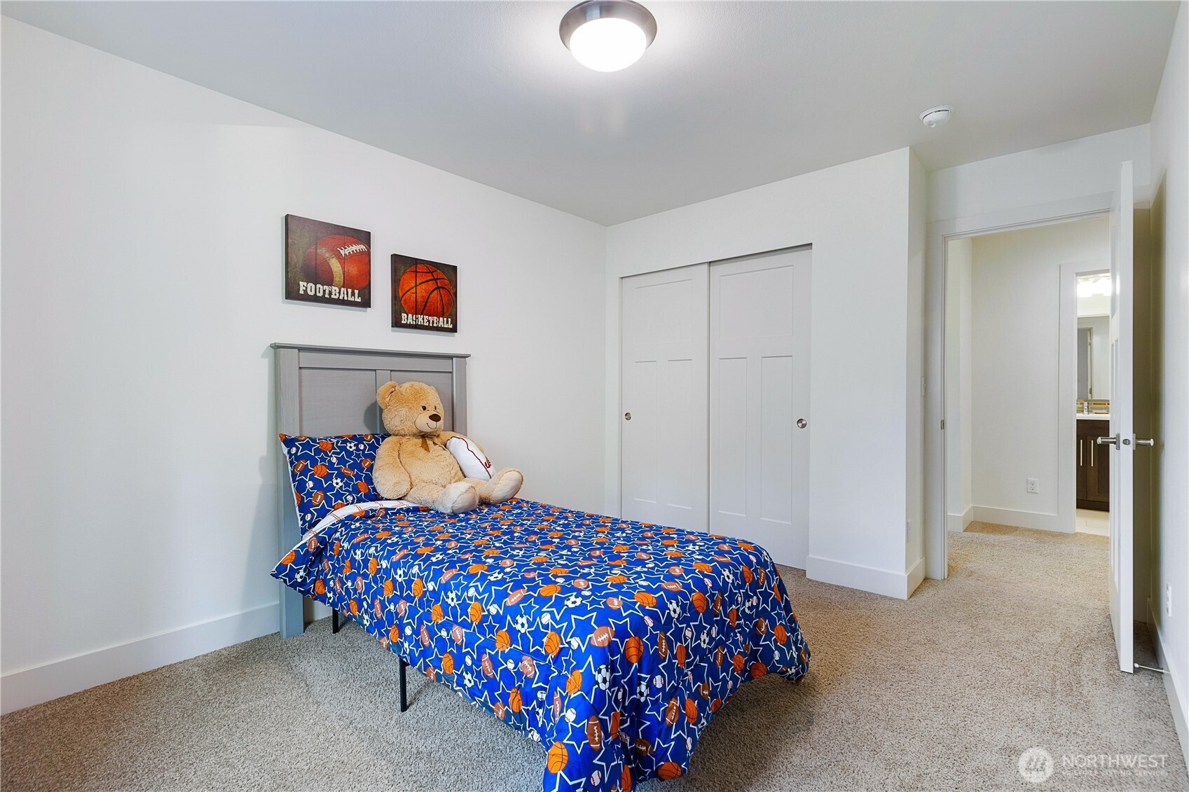 4214 223rd Place Southeast Bothell, WA 98021 - Photo 28 of 37 a bedroom with a bed and a chandelier