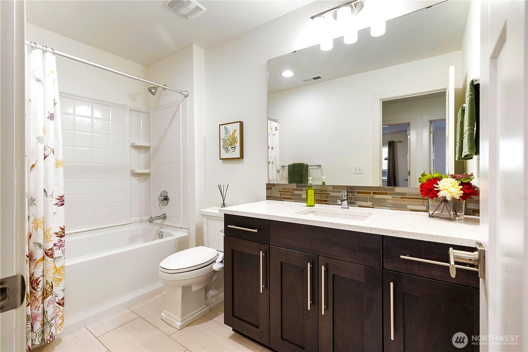 4214 223rd Place Southeast Bothell, WA 98021 - Photo 29 of 37 a bathroom with a sink a toilet and shower